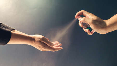 Close up hand people, Spry alcohol cleaning hand for protecting virusの写真素材