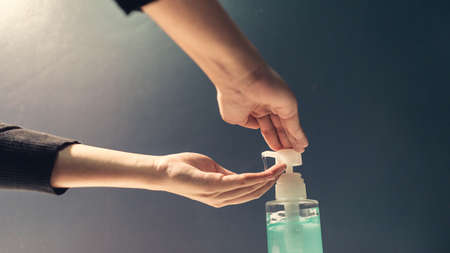 Close up hand people, alcohol gel cleaning hand for protecting virusの写真素材