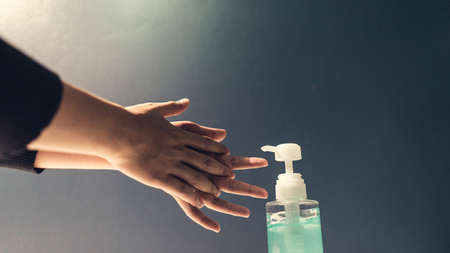 Close up hand people, alcohol gel cleaning hand for protecting the virusの写真素材
