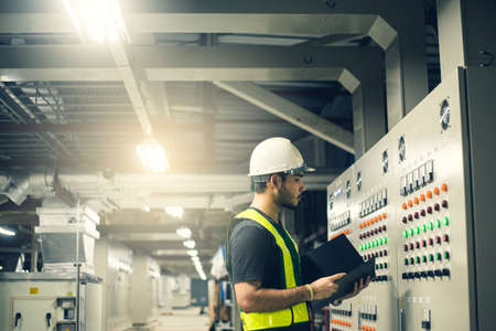 Electrical Engineer team working front control panel.の写真素材