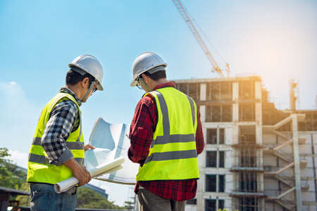 Civil engineer project construction work. Engineer foreman discussion work control to building construction working in site.の写真素材