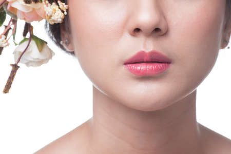 Close up pink Mouth of asian woman on white background.の写真素材
