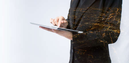 Double exposure business people working on digital tablet in the cityscape.