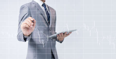 Businessman use tablet for analysis trend graph interface. Business strategy.の写真素材