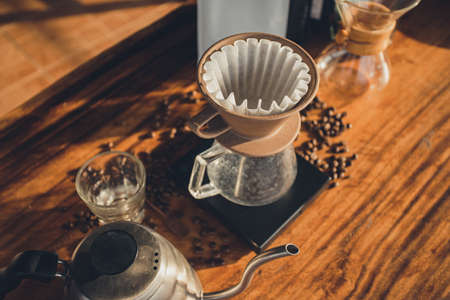 Coffee filter on jug coffee on scales. The process of making drip coffee.の写真素材