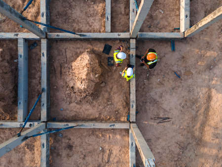 Top view team civil engineer consultant discussion meeting and inspection structure prefabricated concrete in construction site work.の写真素材