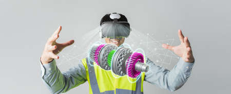 Asian man Engineer wearing VR headset design machine part Automatic Gear Transmission project on...