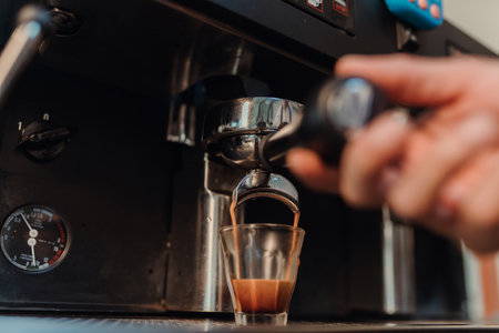 Closeup cocffee espresso pouring from espresso machine. Espresso shot, Coffee making concept.の写真素材
