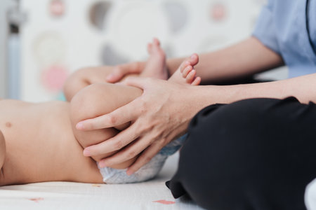 Closeup, Baby massage and exercises, Baby massage for stimulate development by mother. Mother makes massage for happy baby. Infant healthcare concept.の写真素材