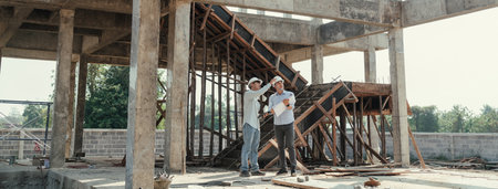 Civil engineer team meeting, discussing plan construction in blueprint at construction site....