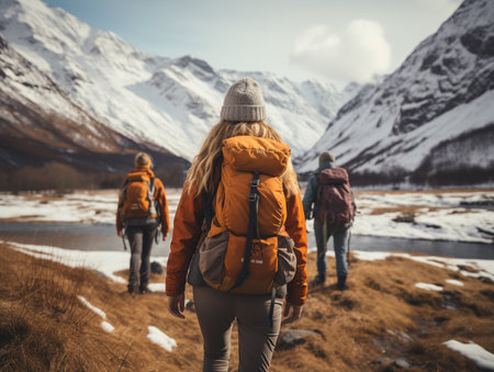 Tourist woman hiker wear a sweater with backpack with mountains. Adventure travel trip. Hike trip to mountain in winter season. Female traveler backpacker.の素材