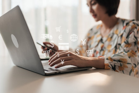Selective focus hand of Asian woman customer using computer laptop shopping online. Business e-commerce online marketing concept.の写真素材