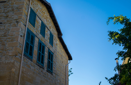 blue windows in old town - cyprusの写真素材
