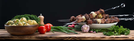 Barbecue and vegetables isolated on black backgroundの写真素材