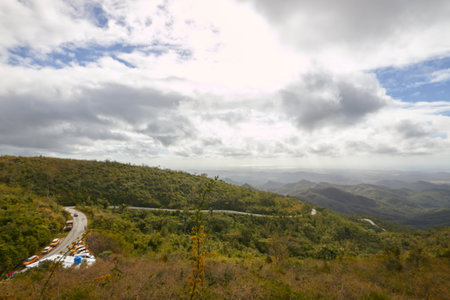 Beautiful panoramic views from a viewpoint with lush vegetation and views of the sea and the skyの写真素材