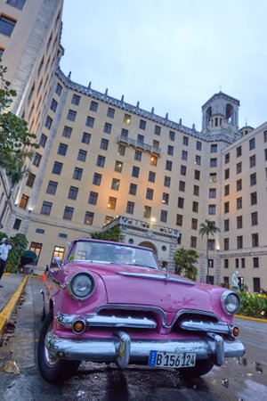 Close-up of a classic American car in Cuba with buildings in the backgroundのeditorial素材