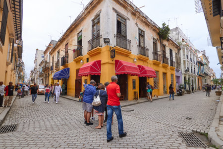 People strolling quietly at a fork in a street in Cubaのeditorial素材