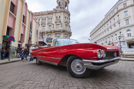 Close-up of a classic American car in Cuba with buildings in the background and famous localのeditorial素材