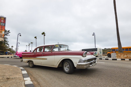 Classic American car on a street in Cuba turning in a curve inのeditorial素材