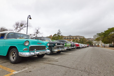 Parking full of classic American cars on a street in Cubaのeditorial素材