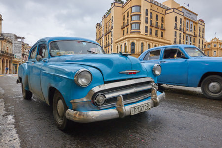 Close-up of a classic American car in Cuba with buildings in the backgroundのeditorial素材