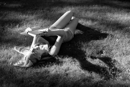 a beautiful girl walks and engaged in self-education preparing for admission to the Universityの写真素材