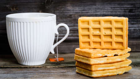 cup of delicious tea early in the morning at the table.の写真素材