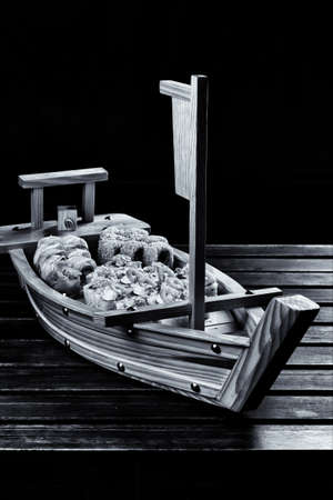 Delicious sushi on wooden desk from the different products on the Japanese recipe.の写真素材