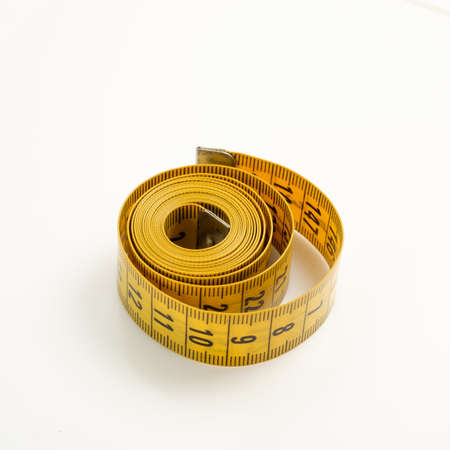 Yellow soft meter for home affairs on a white background.の写真素材