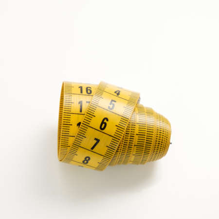 Yellow soft meter for home affairs on a white background.の写真素材