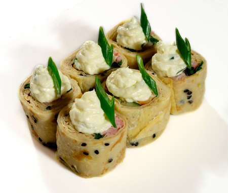 Delicious Japanese sushi beautiful from different ingredients on a white background.