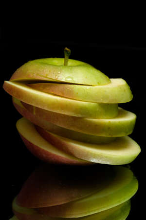 apple on a black background with reflection.の写真素材