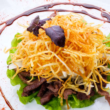 Delicious fresh dishes from the restaurant menu of fresh vegetables and products on a white dish.の写真素材