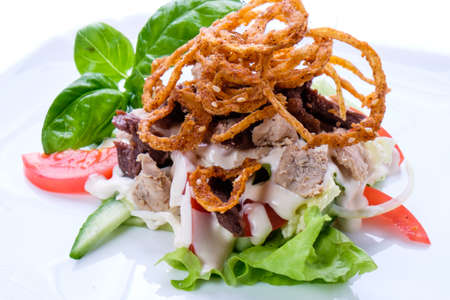 Delicious fresh dishes from the restaurant menu of fresh vegetables and products on a white dish.の写真素材