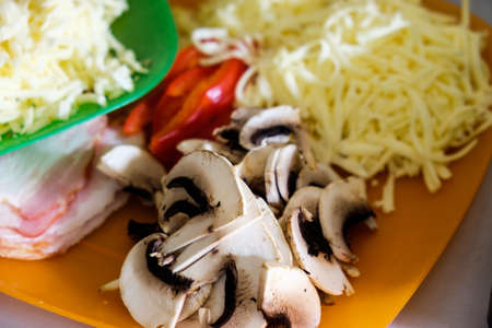 The cook at the restaurant prepared with vegetables and products for making delicious pizza.の写真素材