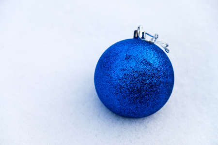 Christmas ball on this white snow in Siberia.の写真素材
