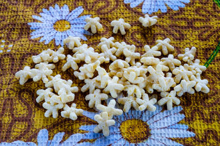 corn flakes in the form of stars on the background color of yellow towel.