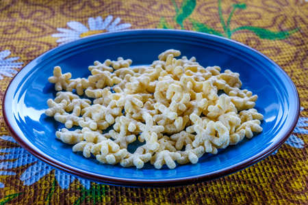 corn flakes in the form of stars on the background color of yellow towel.の写真素材