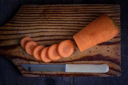 Carrots on wooden boards rustic style in a modern and trendy style.の写真素材