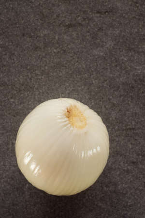 Onion on the beautiful stone backgroundの写真素材