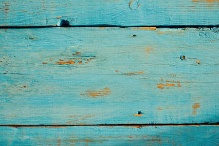 blue wooden planks taken from a high angle to the light from a windowの写真素材