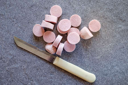 Fresh beautiful sausage, on the beautiful stone backgroundの写真素材