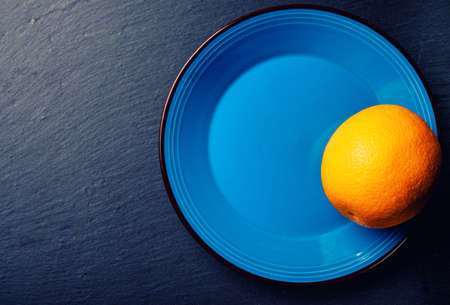 fresh citrus half cut fruits overhead on wooden tableの写真素材