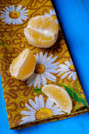 fresh citrus half cut fruits overhead on wooden table