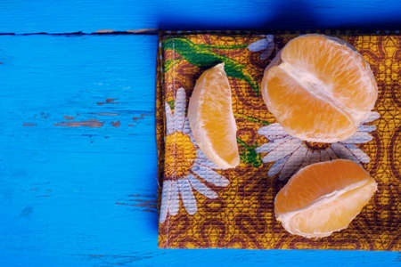 fresh citrus half cut fruits overhead on wooden tableの写真素材