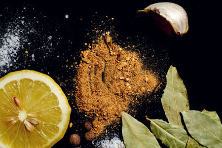 Herbs and spices on an old black metal pan.の写真素材