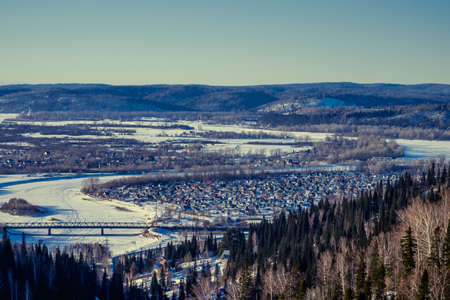 Winter landscape, small houses increased in Siberia, Russiaの写真素材