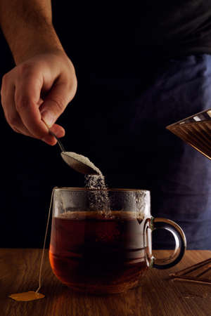 Glass cup of tea on black background.の写真素材