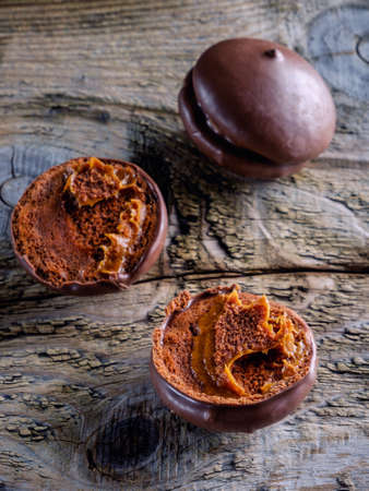 Tasty cookies on a wooden background. Lighted studio lights.の写真素材