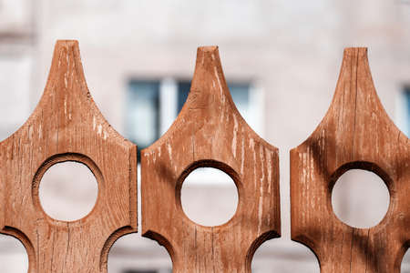 Old wooden painted  vintage background with carved elements and cracked paint. Part of the outdoors decorationの写真素材